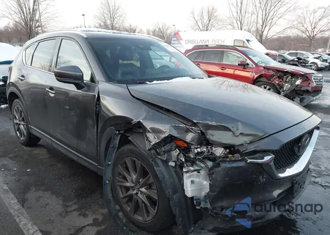 2021 Mazda Cx-5 Signature z USA, uszkodzony, nr VIN JM3KFBEY6M0358024